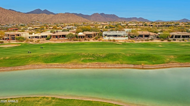 surrounding community featuring a yard and a water and mountain view