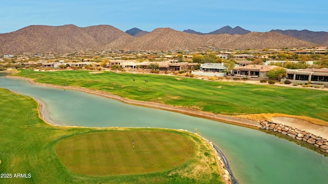 exterior space with a water and mountain view