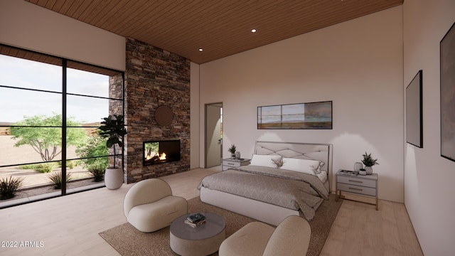 bedroom with a towering ceiling, light hardwood / wood-style floors, wooden ceiling, and a fireplace