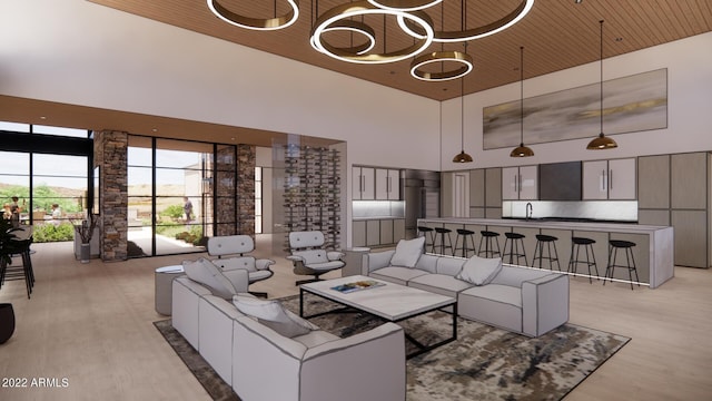 living room with a chandelier, light hardwood / wood-style floors, sink, a towering ceiling, and wooden ceiling