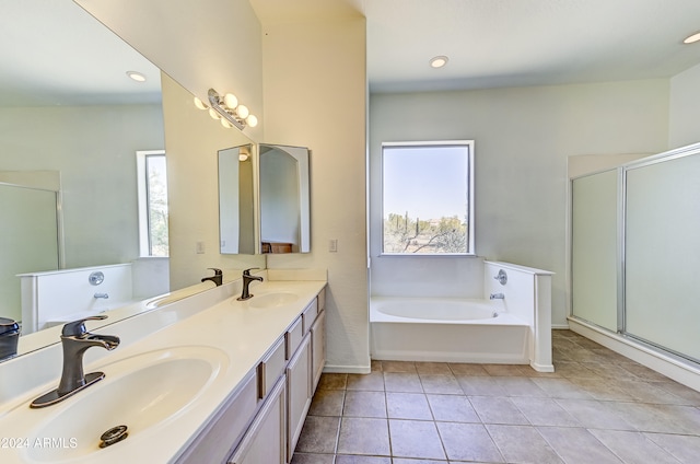 bathroom featuring plus walk in shower, tile patterned floors, and vanity