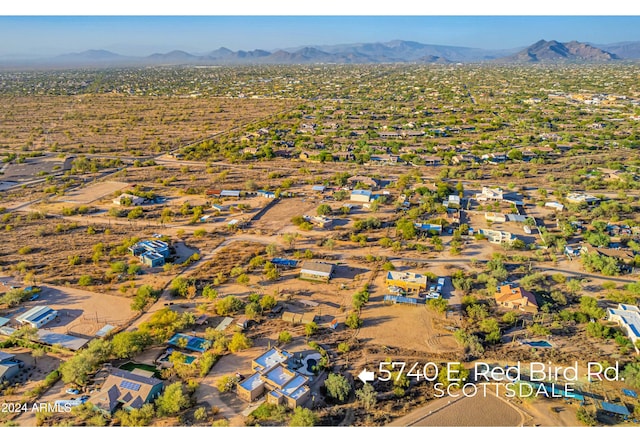 birds eye view of property featuring a mountain view