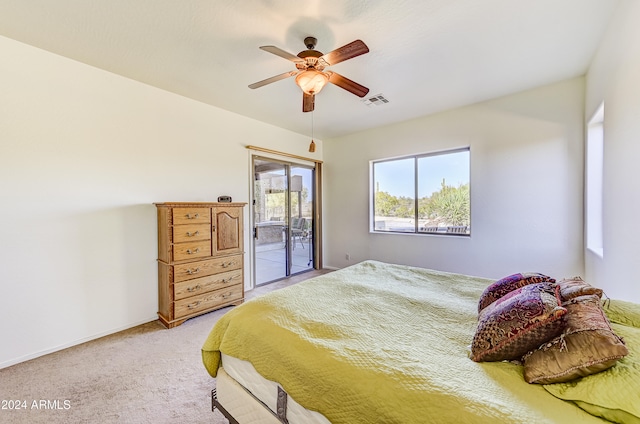 bedroom with ceiling fan, access to exterior, and carpet floors