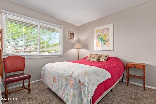 carpeted bedroom with baseboards