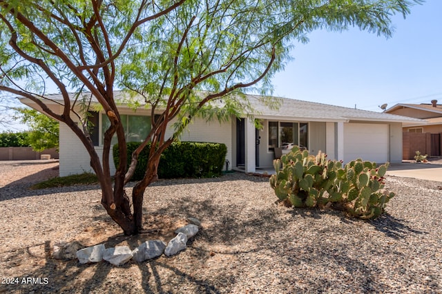 ranch-style house featuring a garage