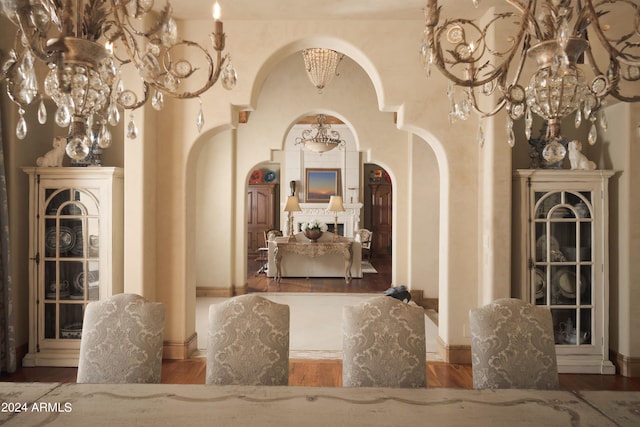 interior space with hardwood / wood-style floors and a notable chandelier