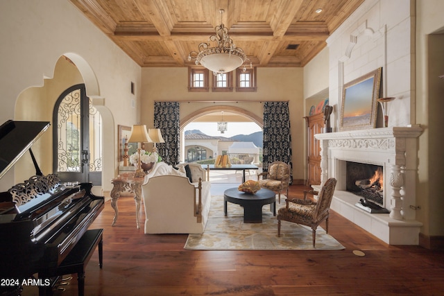 living room with coffered ceiling, wood ceiling, dark hardwood / wood-style flooring, and beamed ceiling