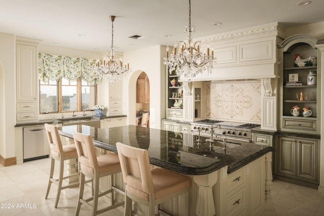 kitchen with backsplash, dishwasher, dark stone counters, a kitchen bar, and a center island with sink