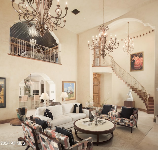 living room with an inviting chandelier and a high ceiling