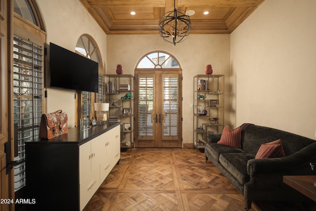 living room with wood ceiling, parquet floors, a notable chandelier, and french doors