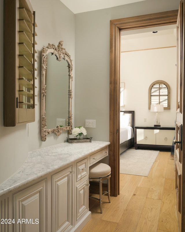 bathroom with vanity and hardwood / wood-style floors