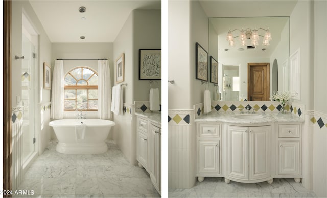 bathroom featuring vanity, tile walls, tasteful backsplash, and a bathtub