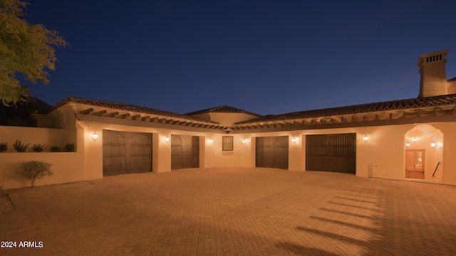 mediterranean / spanish-style house featuring a garage