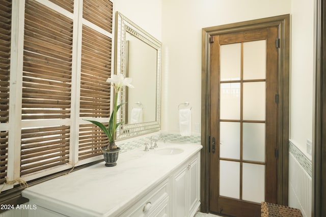 bathroom with a wealth of natural light and vanity