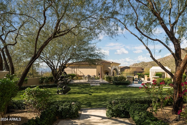 exterior space featuring a patio area and a gazebo