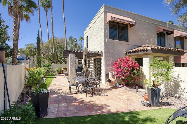 view of patio featuring a pergola and a fenced backyard