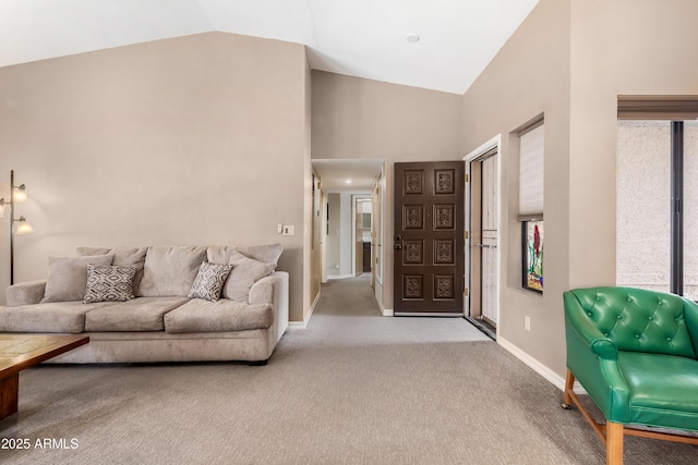 living room featuring lofted ceiling and light colored carpet