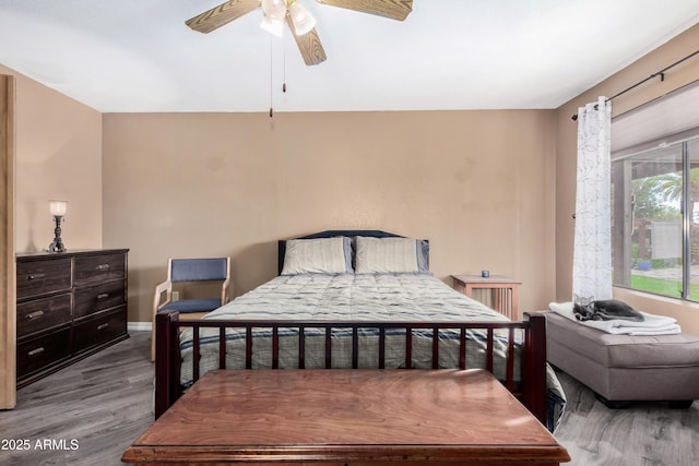 bedroom featuring ceiling fan and hardwood / wood-style floors