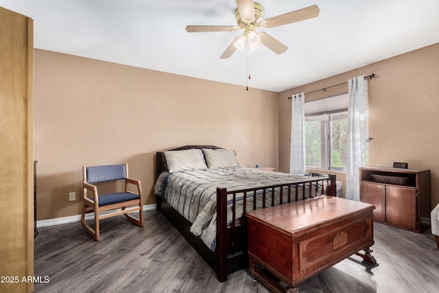 bedroom with wood-type flooring and ceiling fan