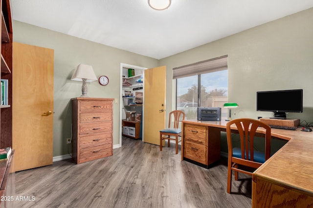 home office featuring hardwood / wood-style floors