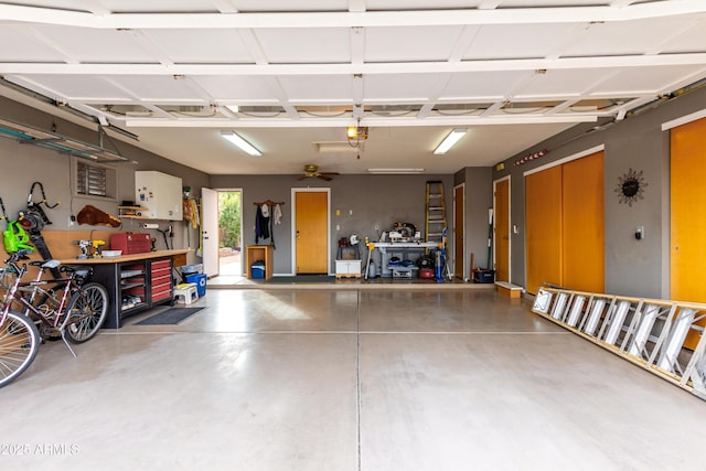 garage featuring a garage door opener and a workshop area