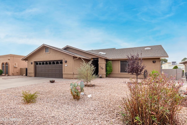 ranch-style home featuring a garage