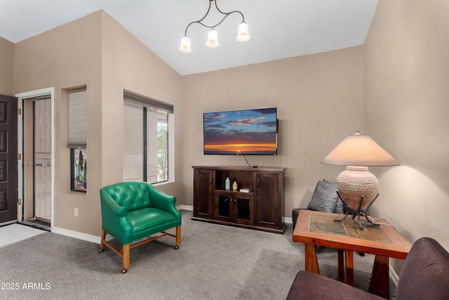 living area featuring lofted ceiling, carpet flooring, and a chandelier