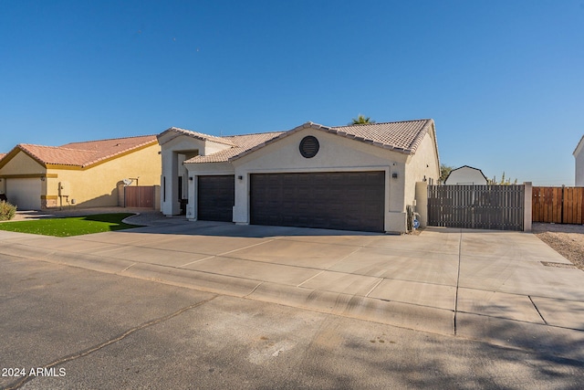 mediterranean / spanish house featuring a garage