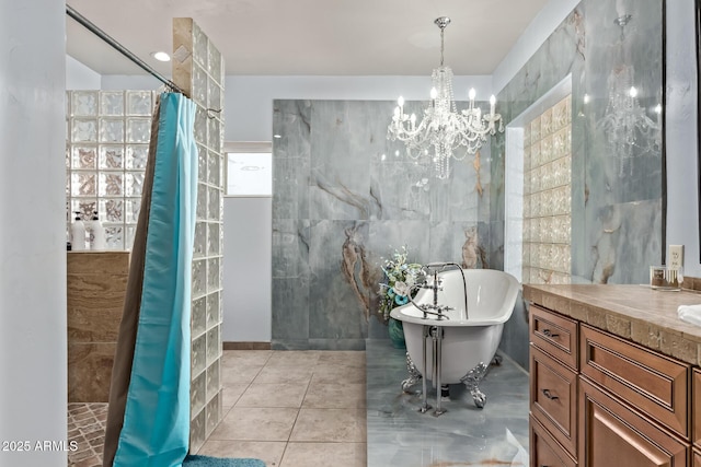 380 N Geneva Estates Rd, Pearce, AZ 85625 - full bathroom featuring tile walls, vanity, a freestanding tub, a chandelier, and a tile shower