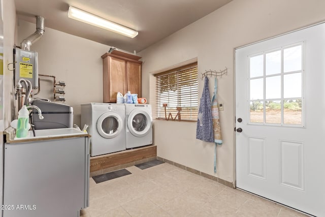 380 N Geneva Estates Rd, Pearce, AZ 85625 - washroom with cabinet space, washer and clothes dryer, plenty of natural light, and water heater