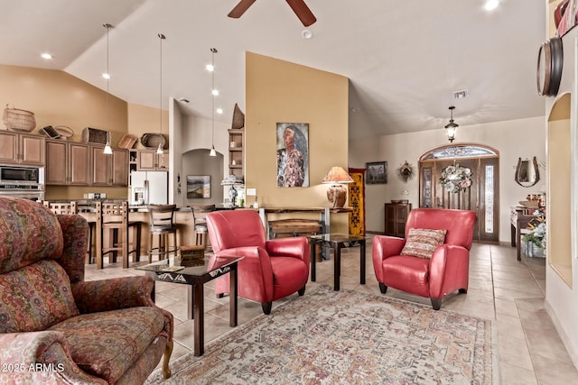 380 N Geneva Estates Rd, Pearce, AZ 85625 - living room with lofted ceiling, ceiling fan, light tile patterned floors, arched walkways, and recessed lighting