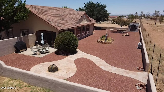 380 N Geneva Estates Rd, Pearce, AZ 85625 - back of house with a patio area, stucco siding, and a tile roof