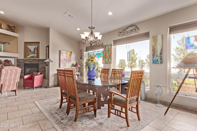 380 N Geneva Estates Rd, Pearce, AZ 85625 - dining space featuring healthy amount of natural light, light tile patterned floors, recessed lighting, a chandelier, and a fireplace