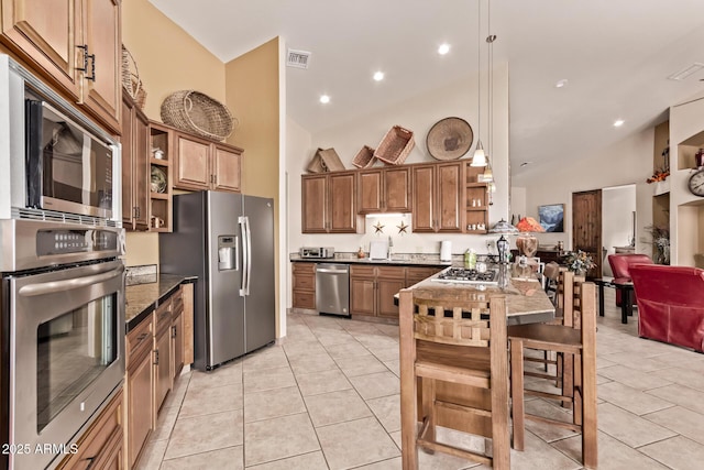 380 N Geneva Estates Rd, Pearce, AZ 85625 - kitchen featuring open shelves, appliances with stainless steel finishes, light tile patterned floors, high vaulted ceiling, and brown cabinetry