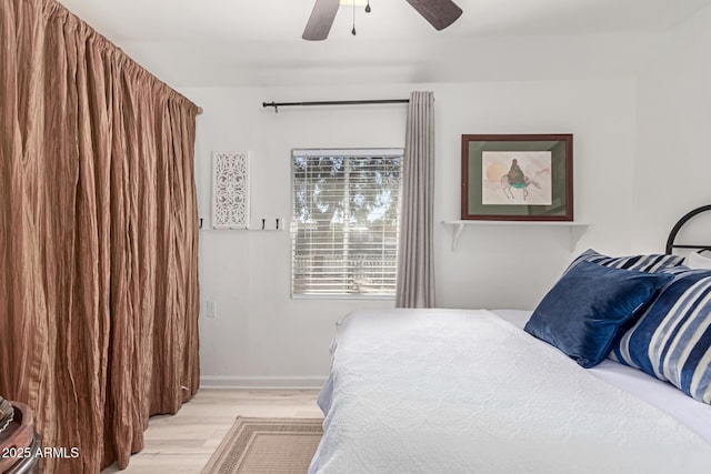 bedroom with ceiling fan and light wood-type flooring