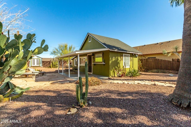 back of house with a patio