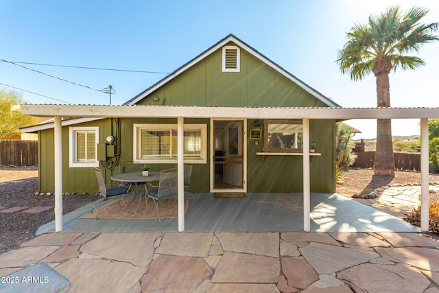 back of house with a patio