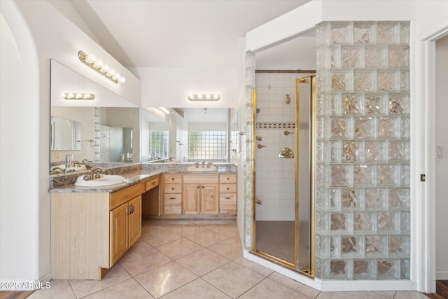 bathroom featuring vanity, an enclosed shower, and tile patterned flooring