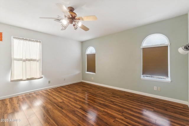 unfurnished room featuring ceiling fan and dark hardwood / wood-style floors