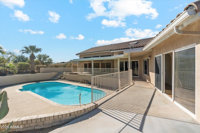 view of swimming pool with a patio