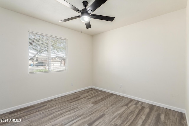 unfurnished room with ceiling fan and light hardwood / wood-style flooring