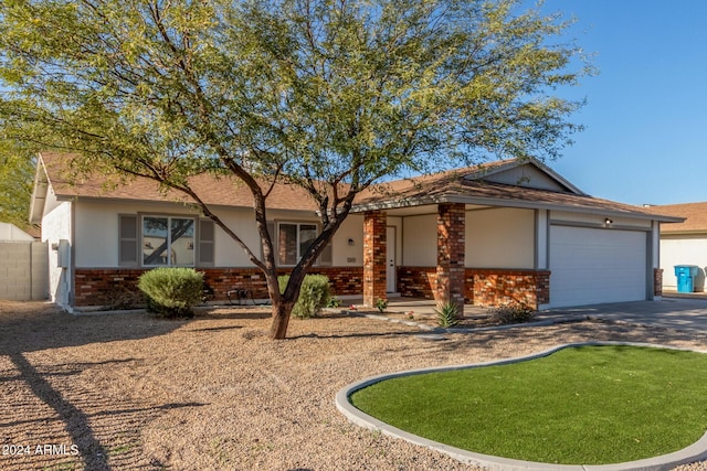 ranch-style house featuring a garage