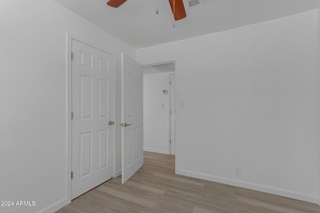 unfurnished bedroom featuring ceiling fan and light wood-type flooring