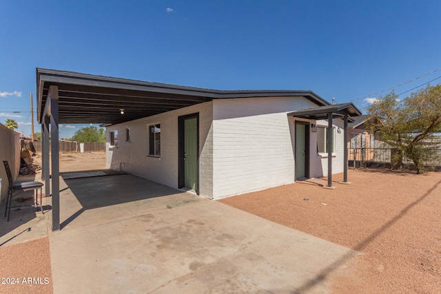 view of side of property featuring a patio area