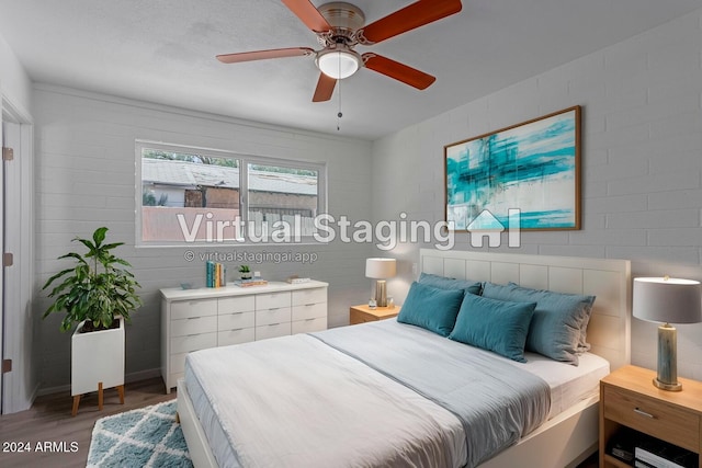 bedroom with ceiling fan and wood-type flooring