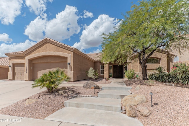 view of front of property with a garage