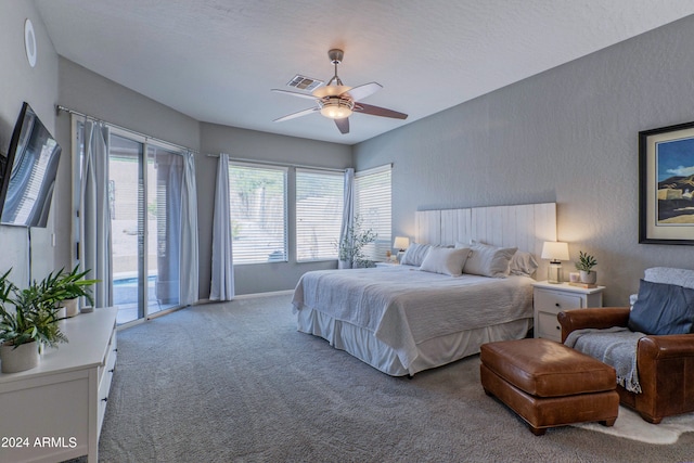 bedroom featuring carpet floors, access to exterior, a textured ceiling, and ceiling fan