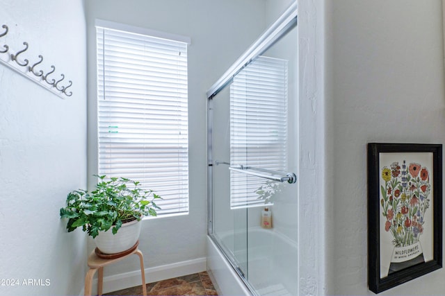 bathroom featuring enclosed tub / shower combo