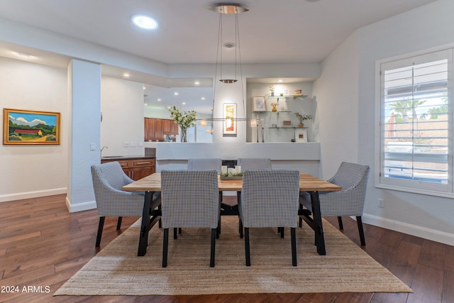 dining area with dark hardwood / wood-style flooring