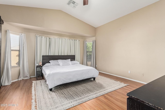 bedroom featuring ceiling fan, vaulted ceiling, and hardwood / wood-style flooring